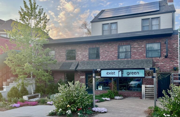 exist green storefront solar panels in spring 768x500